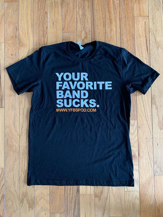 Your Favorite Band Sucks Block Print shirt, navy heather t-shirt laid flat on a wood floor