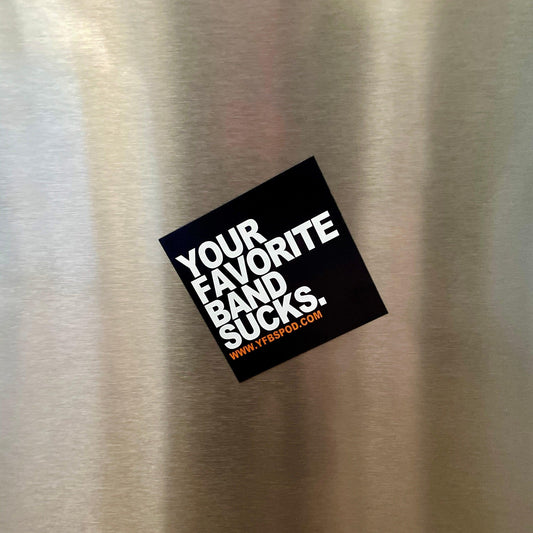 Your Favorite Band Sucks Magnet stuck at an angle on a stainless steel refrigerator door